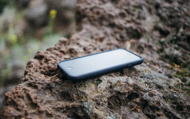 Person relaxing outdoors with a phone put away, practising digital minimalism