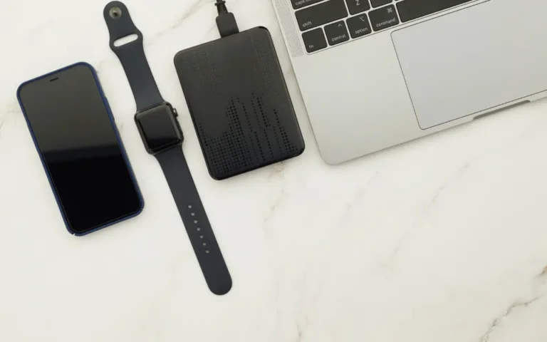 Smartphone and laptop syncing files to cloud storage for a phone backup