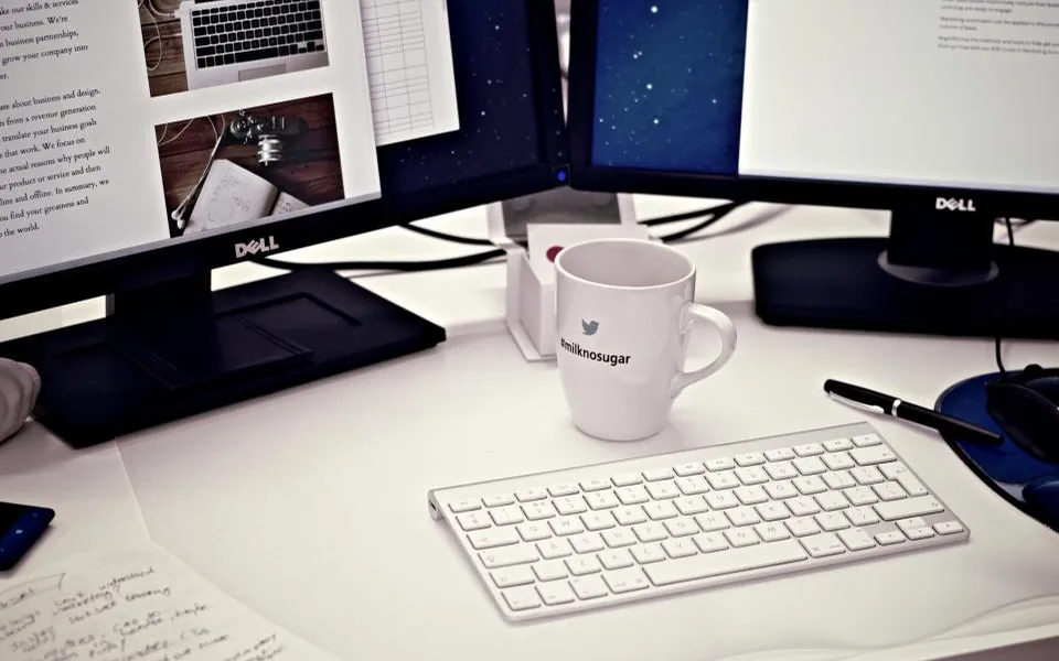 Desktop computer and laptop on a desk ready to compare operating systems